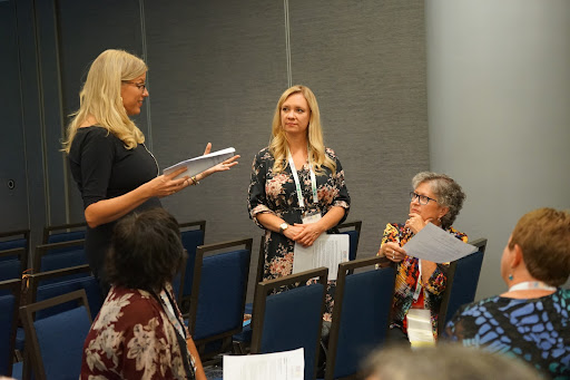 People interacting in a conference room