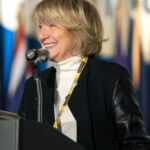 Photo of Yasmina Vinci speaking at a conference